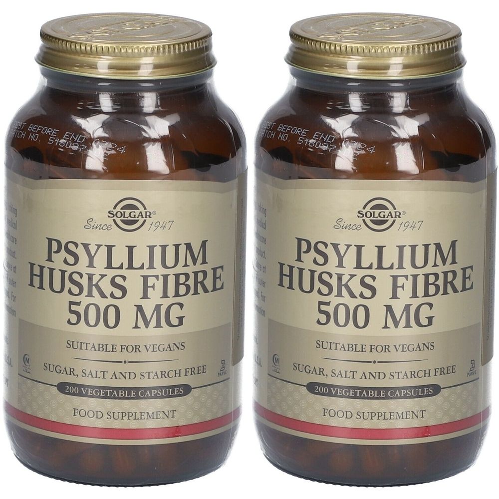 Twee flessen Solgar Psyllium Husks Fibre 500 mg. Bruine glazen flessen met gouden doppen en etiketten.