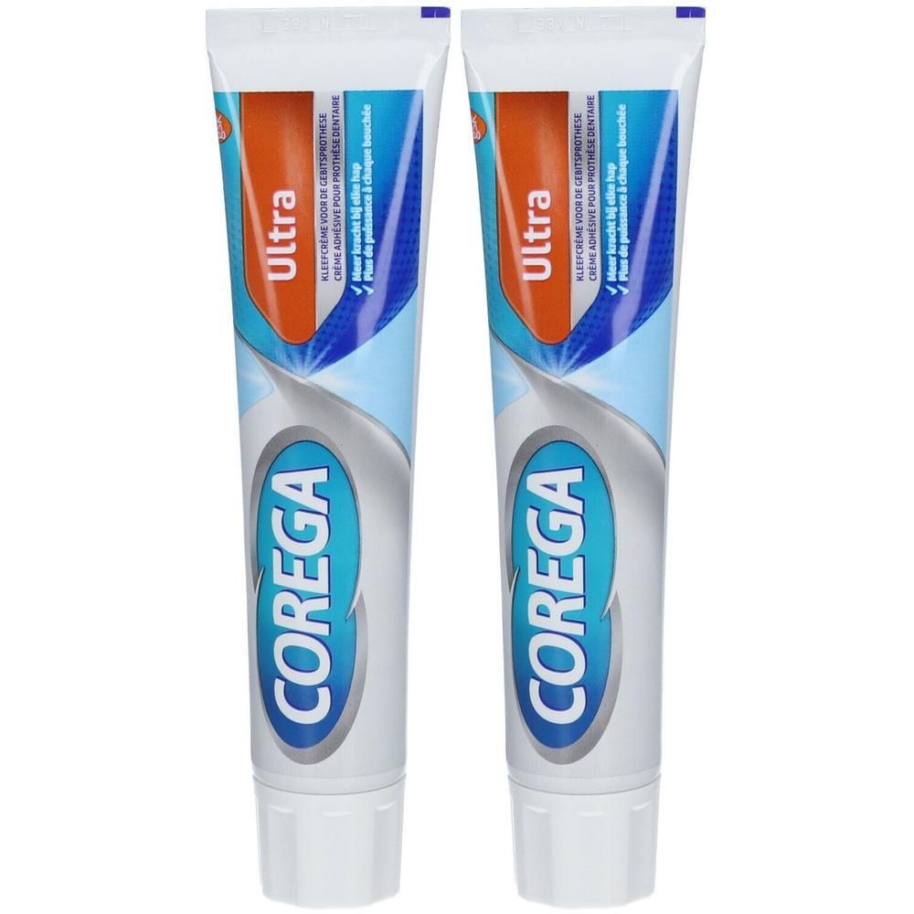 Twee tubes Corega Ultra Fresh Crème Adhesive. Blauwe, witte en oranje verpakking. Tekst: Corega, Ultra.