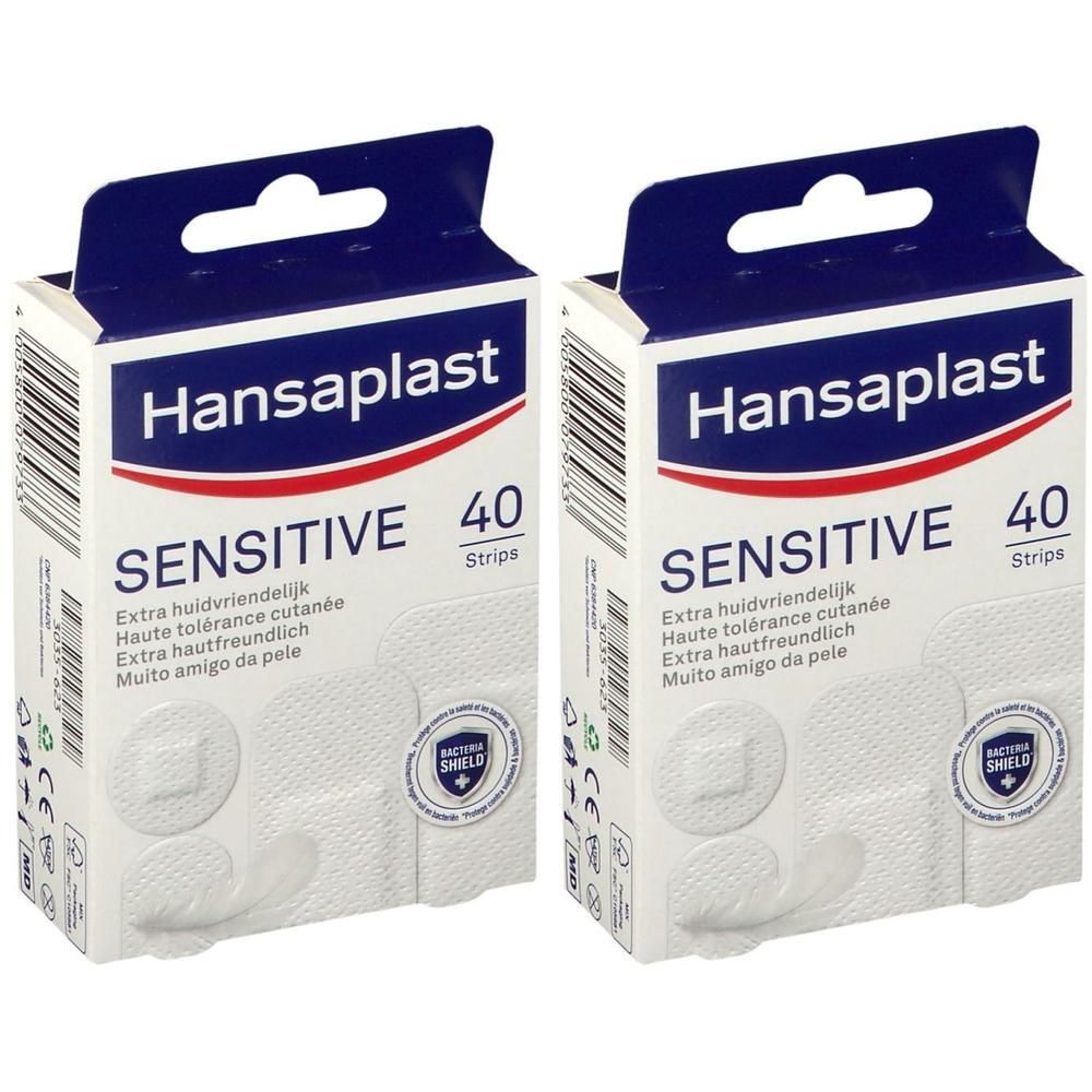 Deux boîtes de pansements Hansaplast Sensitive. Pansements blancs avec centre carré. Emballage avec logo rouge et texte.
