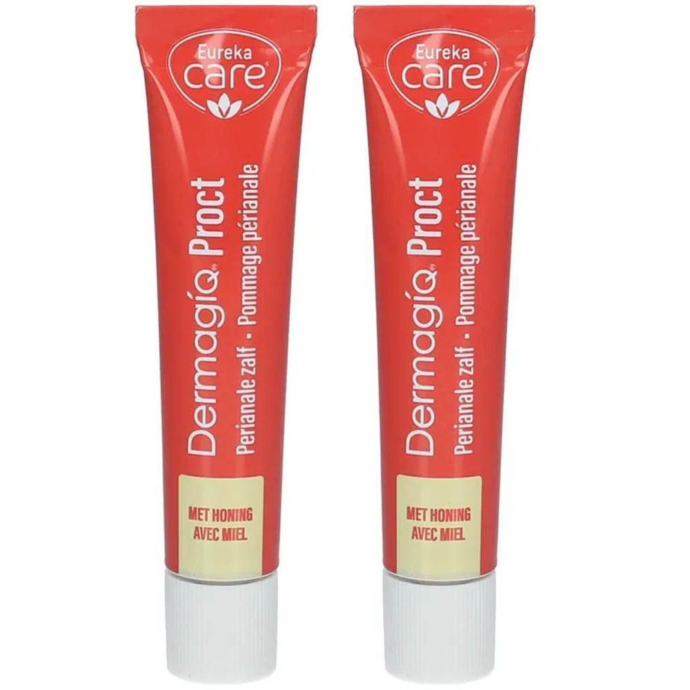 Twee tubes DermagíQ Proct perianale zalf. Rode tubes met witte dop. Opschrift: Eureka Care, honing.