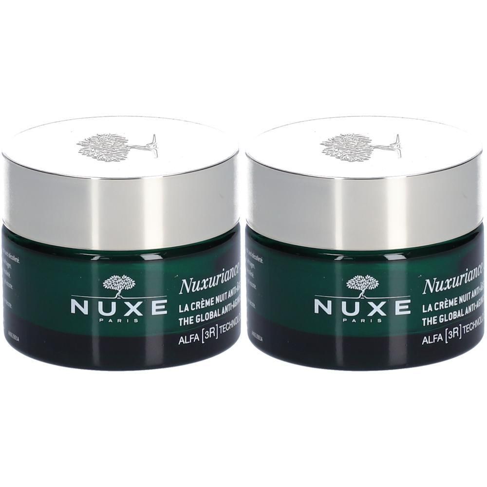 Twee potten NUXE Nuxuriance Ultra Crème Nuit Anti-Âge Global. Groene potten, zilveren deksels. Logo en tekst.