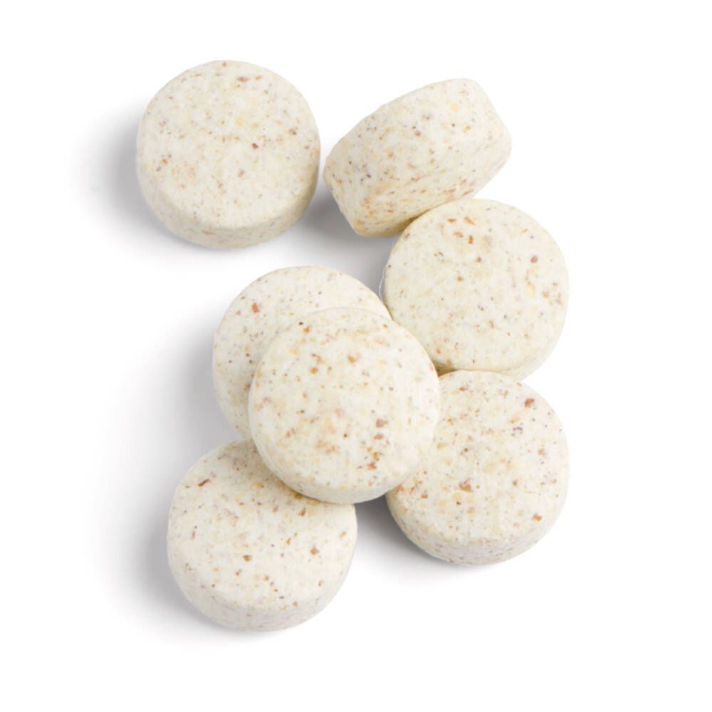 Sept comprimés ronds. Couleur claire avec petits points. Sans emballage.