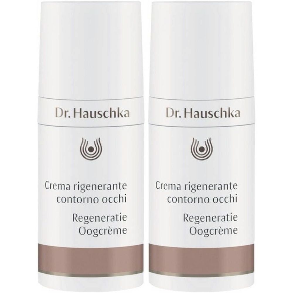 Twee witte crèmetubes met bruine band. Opschrift: Dr. Hauschka, Crema rigenerante contorno occhi, Regeneratie Oogcrème.