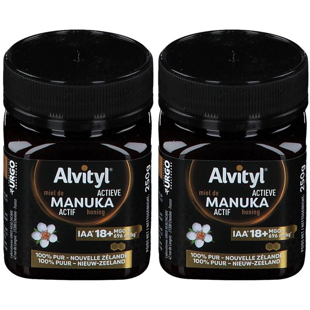 Twee potten Alvityl Manuka-honing ACTIF IAA 18+. Zwarte potten met zwarte deksels. Etiket met productinformatie.