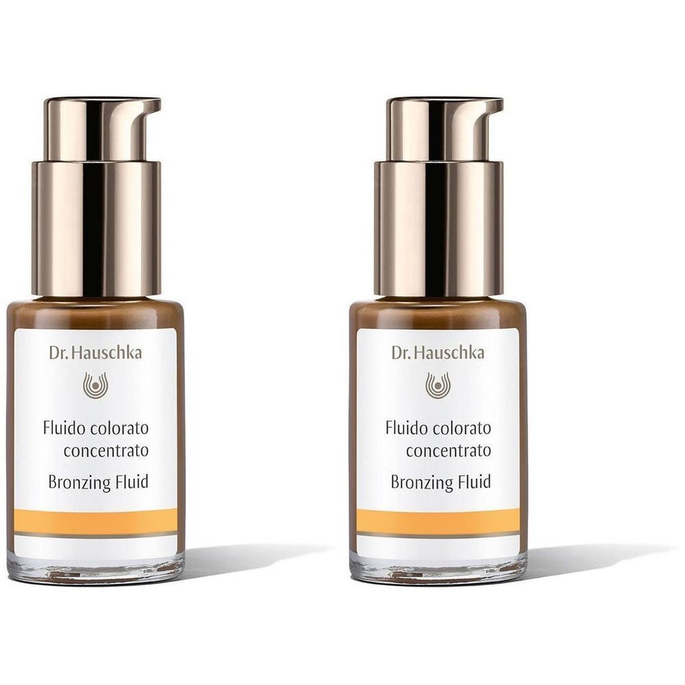 Twee flacons met bruine vloeistof. Opschrift: Dr. Hauschka, Fluido colorato concentrato, Bronzing Fluid.