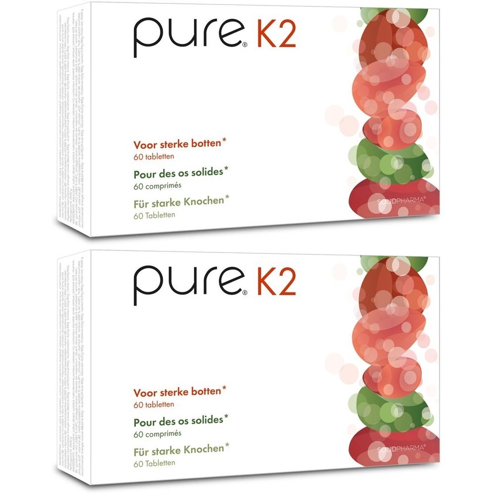 Twee witte dozen met "pure. K2". Tekst in het Nederlands, Frans en Duits. Illustratie van rode en groene vormen.