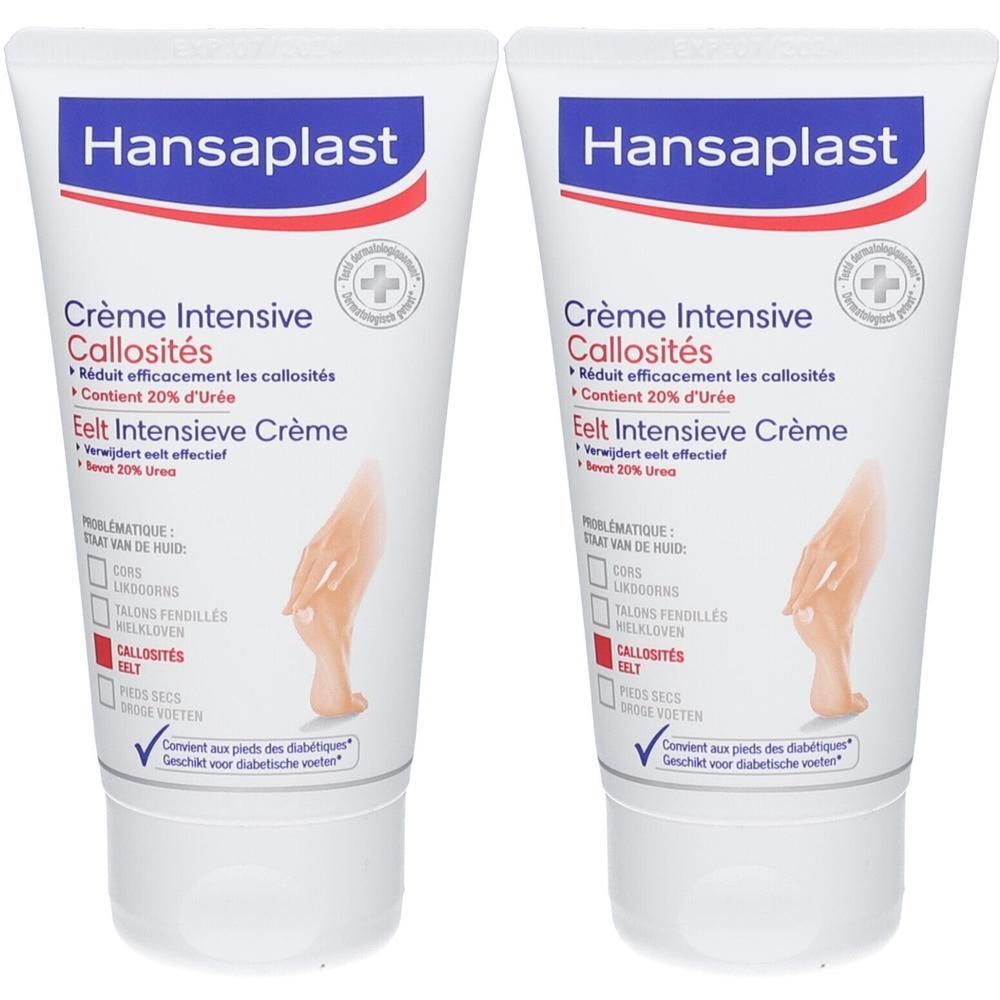 Twee tubes Hansaplast crème. Witte tubes met blauwe en rode tekst. Opschrift: Crème Intensive Callosités, 20% Urea.