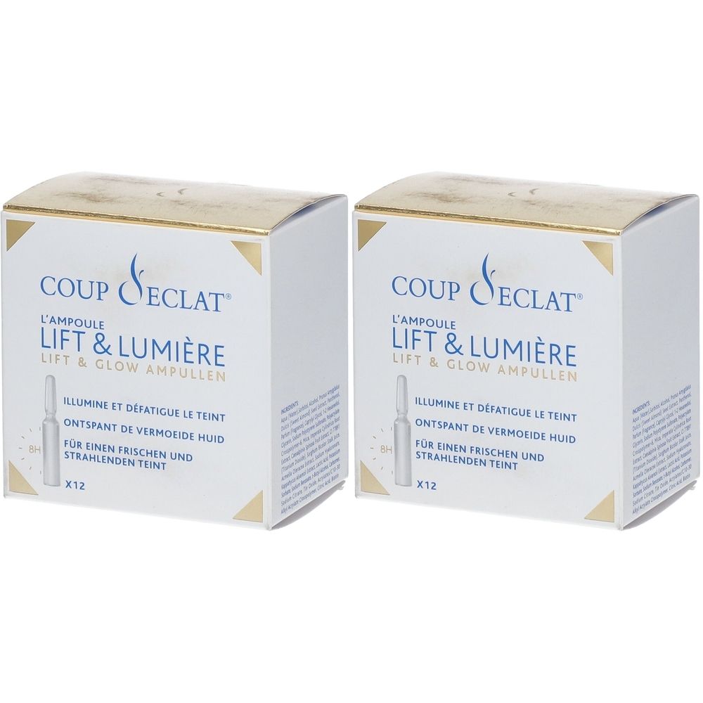 Deux boîtes blanches avec des accents dorés. Inscription : Coup d'Éclat Lift & Lumière. Contient des ampoules. Texte en allemand, français et néerlandais.