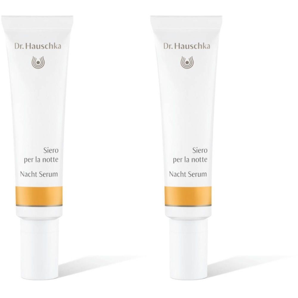 Deux tubes de Sérum de nuit Dr. Hauschka. Tubes blancs avec bande jaune et texte.