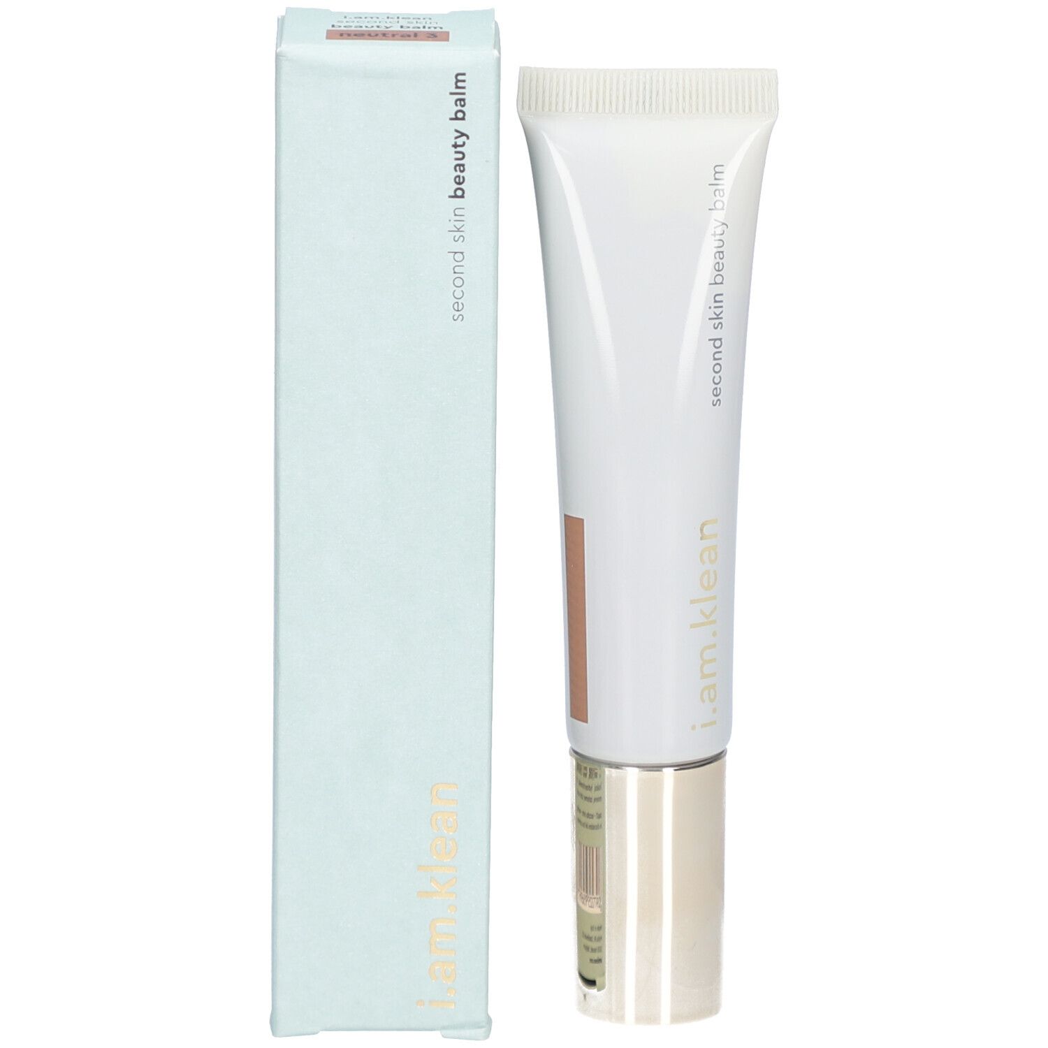 Produit et emballage. Tube blanc avec inscription i.am.klean et Second Skin Beauty Balm. Boîte bleu clair.