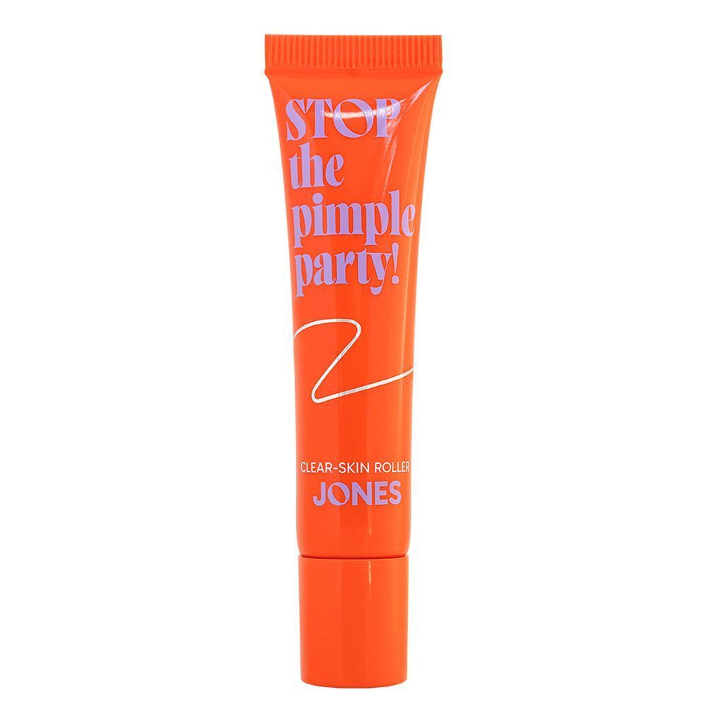 Oranje tube met tekst. Tekst: Stop the Pimple Party! Clear-Skin Roller. Merk: JONES.