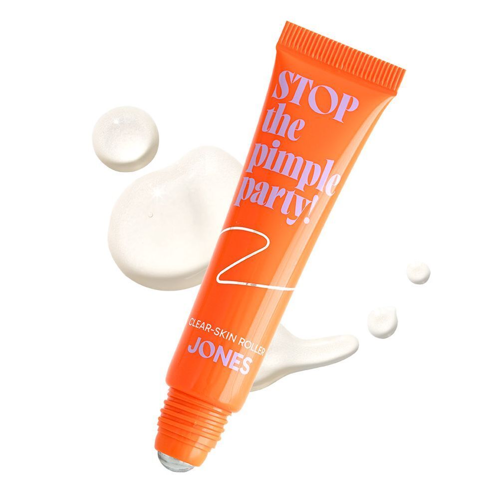 Oranje tube met tekst. Tekst: Stop the Pimple Party! Clear-Skin Roller. Merk: JONES. Product en vloeistof.