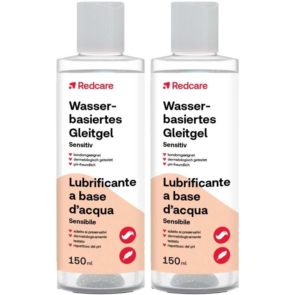 Twee flessen glijmiddel op waterbasis, Gevoelig, met rood Redcare-logo. Opschrift: Lubrificante a base d'acqua, 150ml. 1+1 GRATIS.
