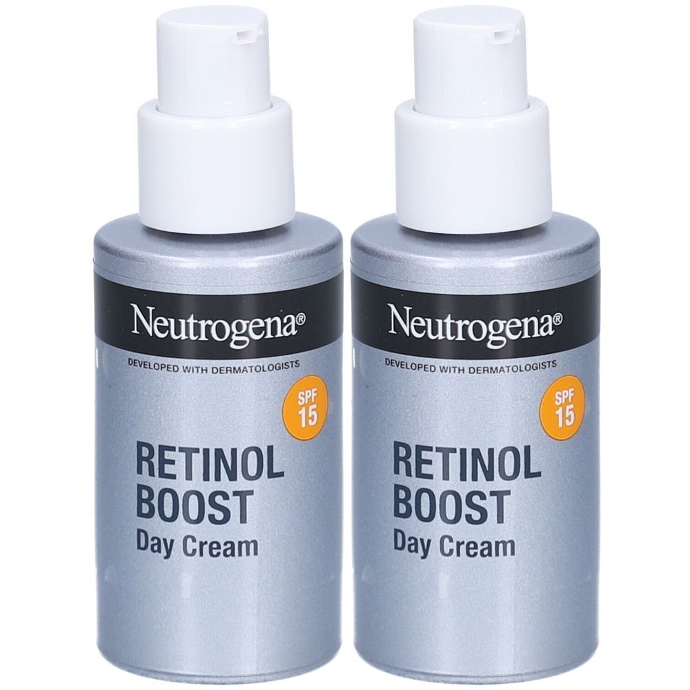 Twee flessen Neutrogena Retinol Boost Dagcrème SPF 15. Grijze flessen met witte pomp. Opschrift: Retinol Boost Day Cream.