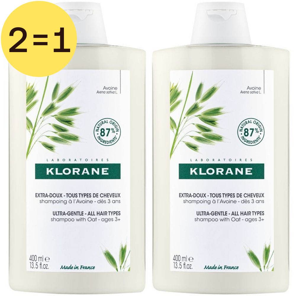 Twee flessen Klorane Shampooing Extra-Doux à l'Avoine. Wit etiket met groene details. 2=1 sticker.