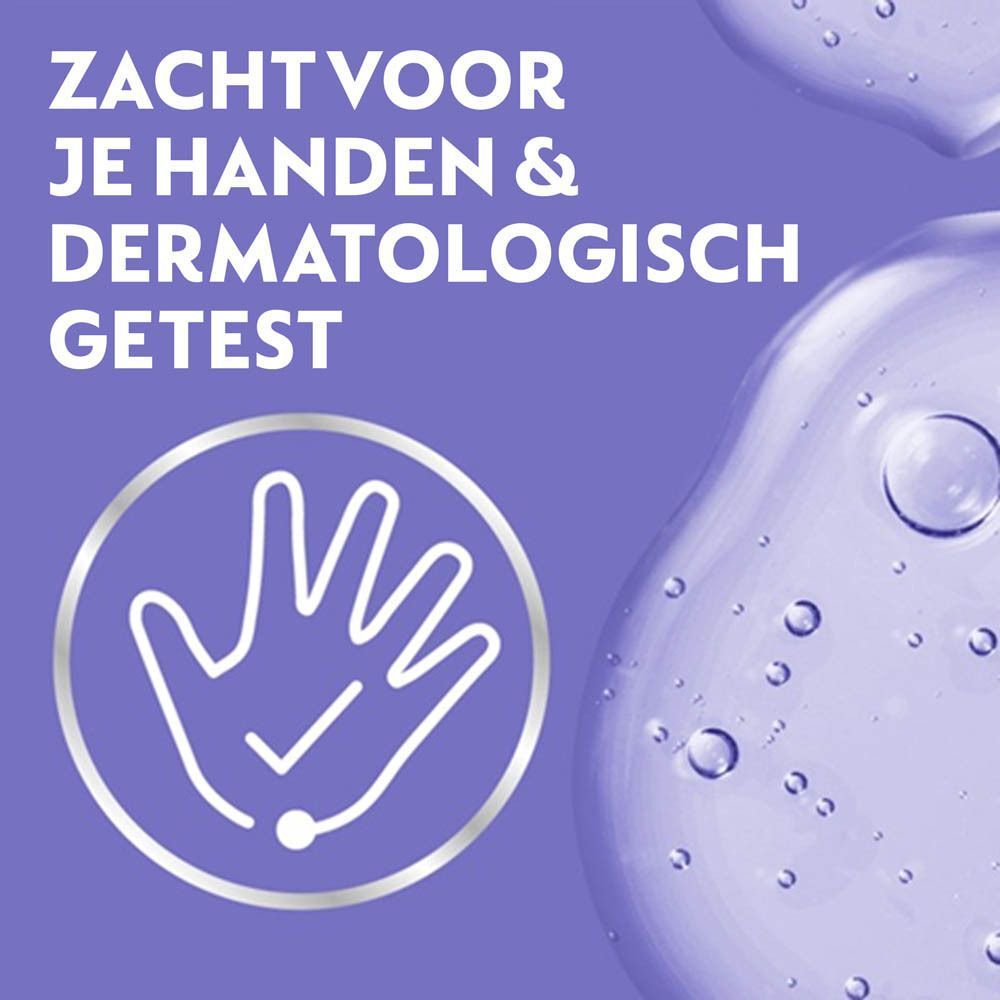 Handen in zeep. Tekst: Zacht voor je handen & dermatologisch getest. Paarse achtergrond.