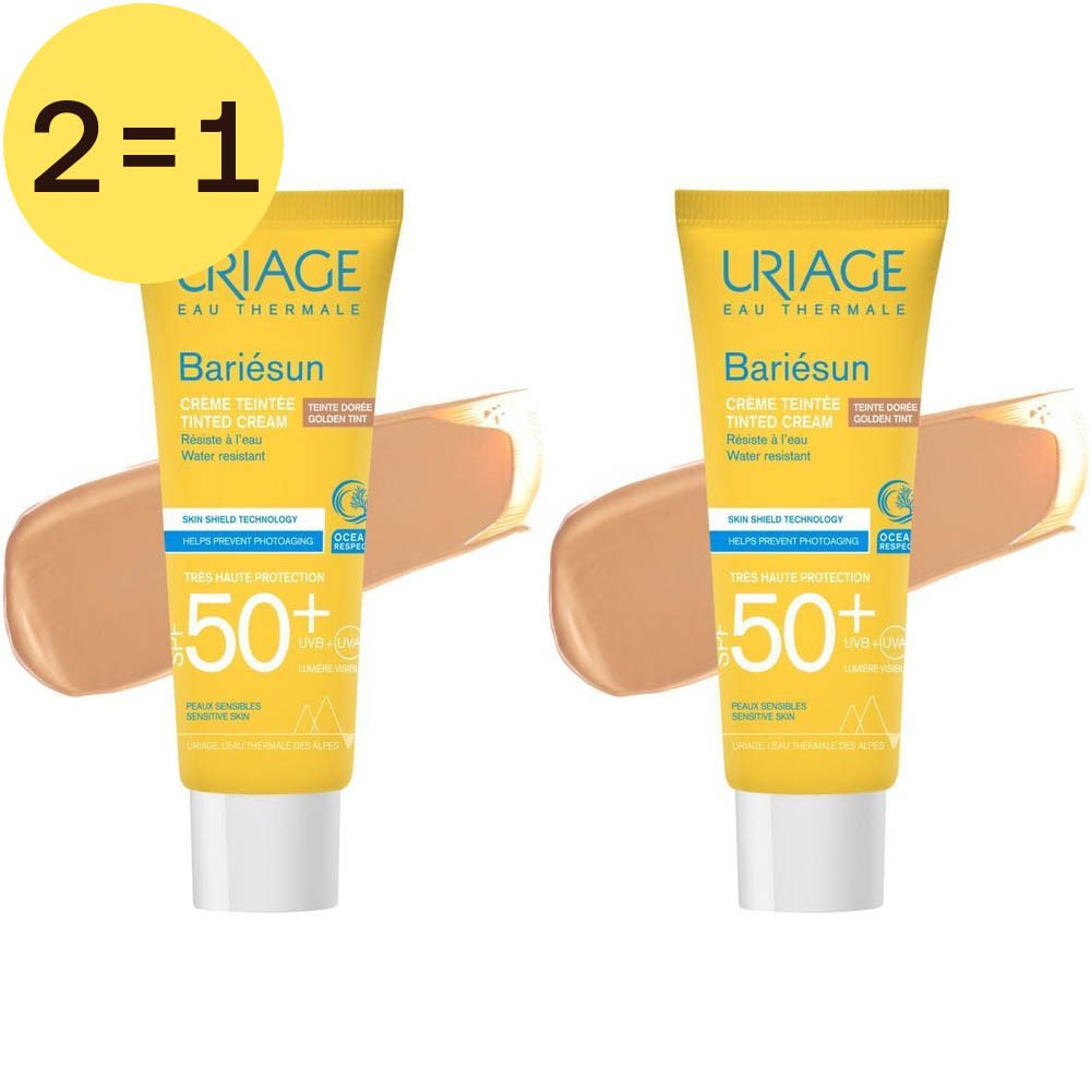 Deux tubes de crème solaire jaune. Inscription: Uriage Bariésun Crème Teintée Dorée SPF50+. Autocollant: 2=1.