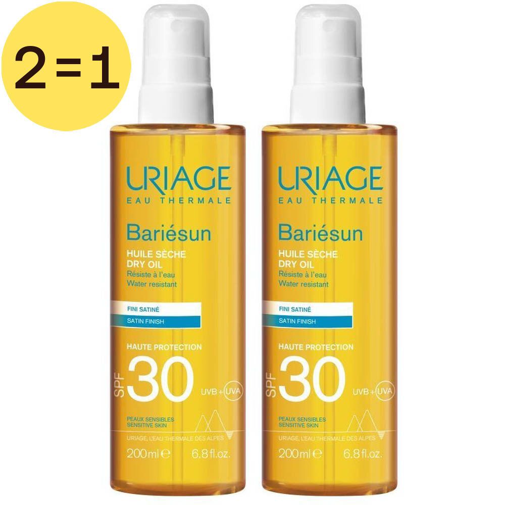 Deux flacons de Uriage Bariésun Huile Sèche SPF30. Liquide jaune dans des flacons pulvérisateurs à bouchon blanc. Inscription : 2=1.