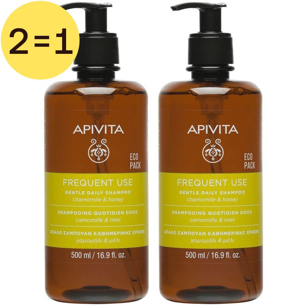 Twee bruine shampoo flessen met zwarte pomp. Opschrift: APIVITA, Frequent Use, kamille & honing. Geel etiket.