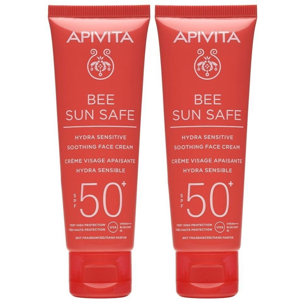Deux tubes de crème solaire. Inscription : APIVITA, BEE SUN SAFE, Hydra Sensitive, SPF 50. Emballage rouge avec texte blanc.