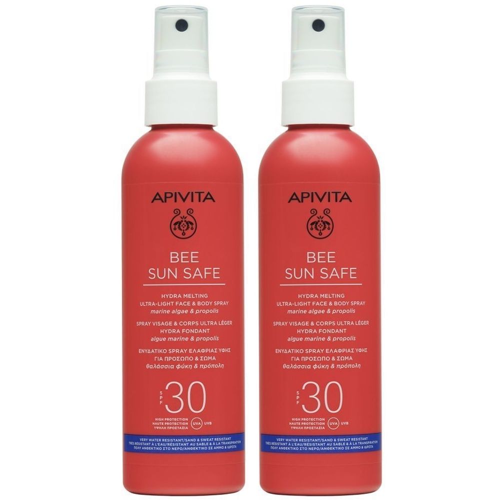 Deux flacons spray rouges avec tête blanche. Inscriptions: APIVITA, BEE SUN SAFE, SPF 30. Produit pour le visage et le corps.