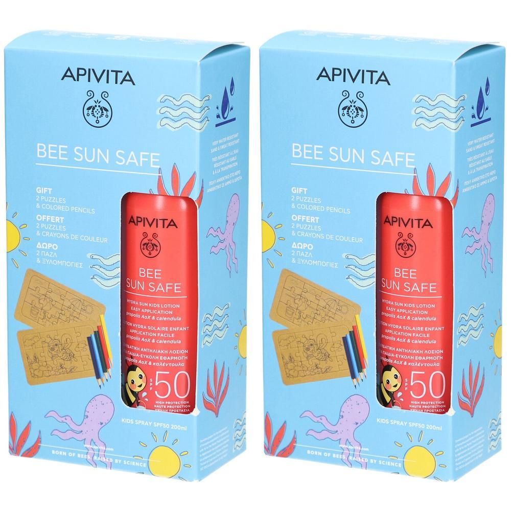 Coffret cadeau avec lotion solaire, puzzles et crayons de couleur. Lotion solaire rouge, emballage bleu avec nom et illustrations.