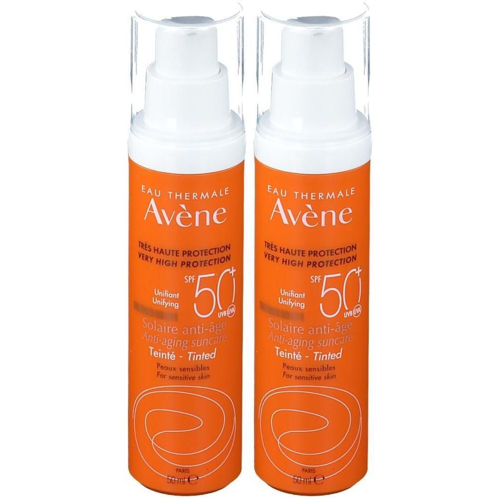 Deux flacons de Avène Solaire Anti-Age teinté SPF 50+. Flacons orange avec pompe blanche. Texte: Très Haute Protection, SPF 50+.