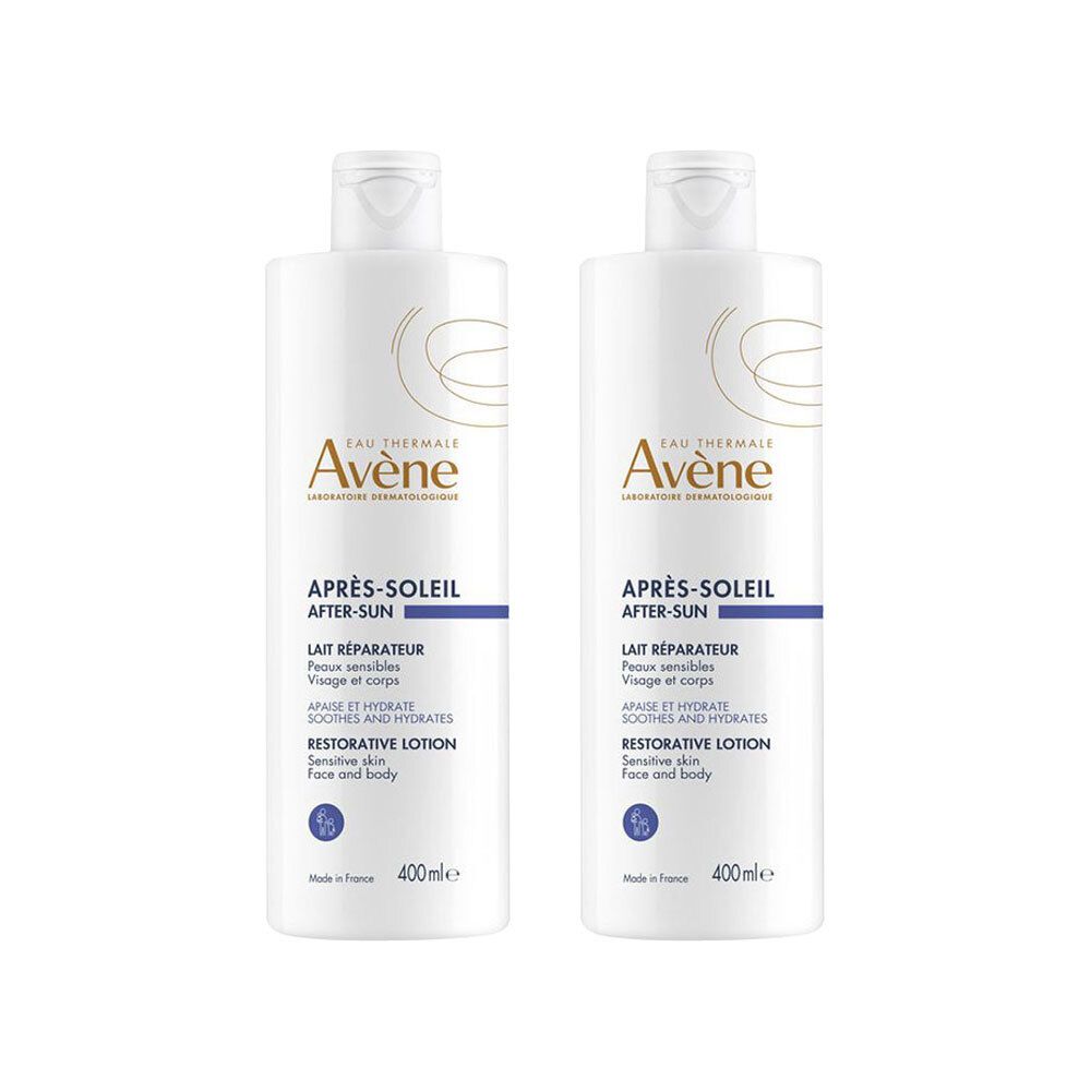 Twee witte flessen "Avène Après-Soleil After-Sun". Tekst: Lait Réparateur, Restorative Lotion. Inhoud: 400 ml.