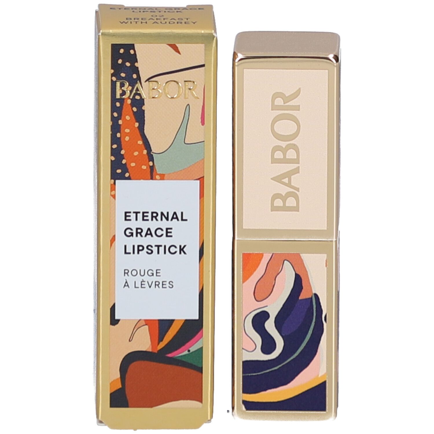 Lipstick en verpakking. Gouden verpakking met kleurrijk patroon. Productnaam en merk zichtbaar.