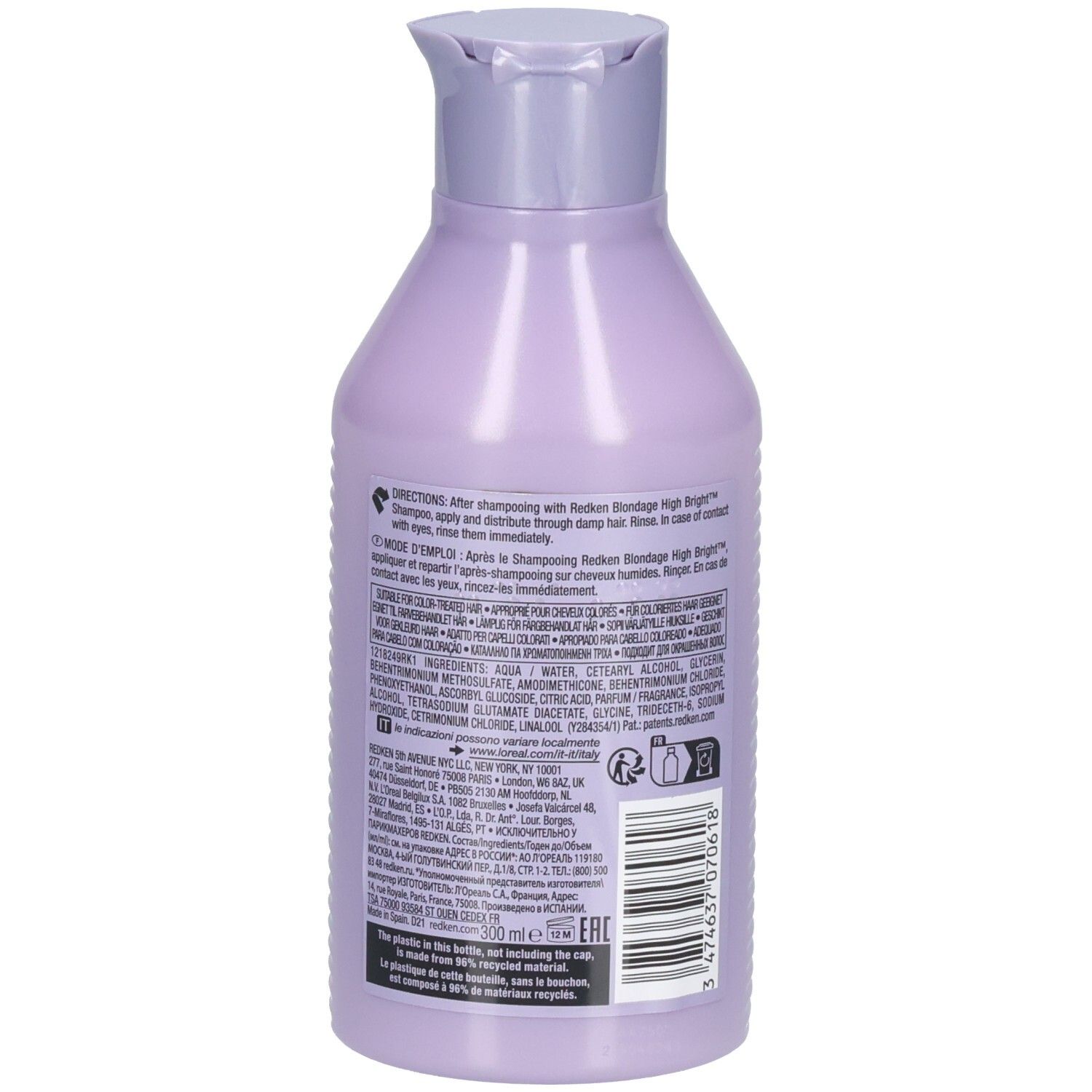 Achterkant van de Redken Blondage High Bright Conditioner fles. Bevat tekst en barcode. Lila van kleur.
