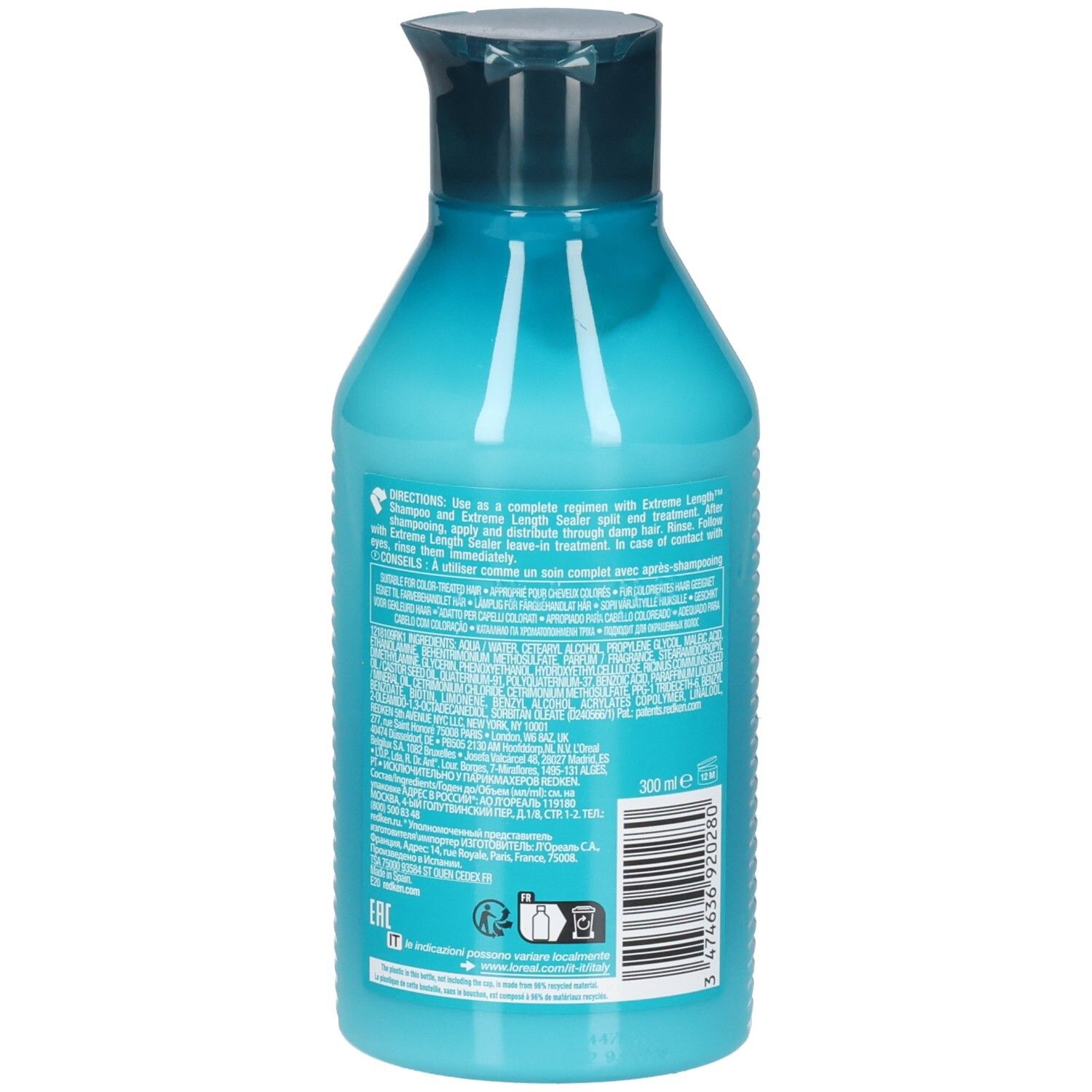 Achterkant van een turquoise fles met donkerblauwe dop. Tekstinformatie en streepjescode. Bevat REDKEN Extreme Length Conditioner.