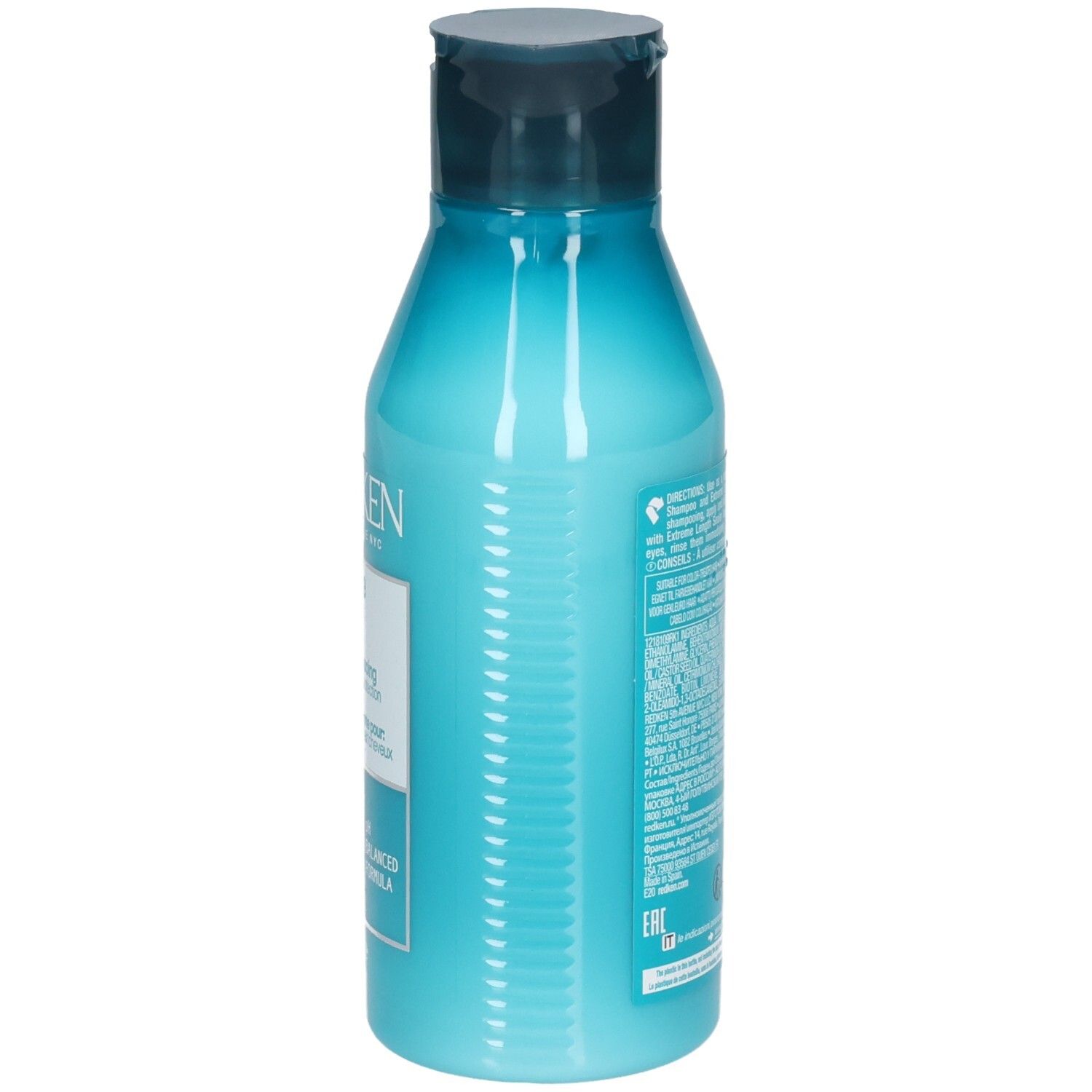 Zijkant van een turquoise fles met donkerblauwe dop. Tekstinformatie. Bevat REDKEN Extreme Length Conditioner.