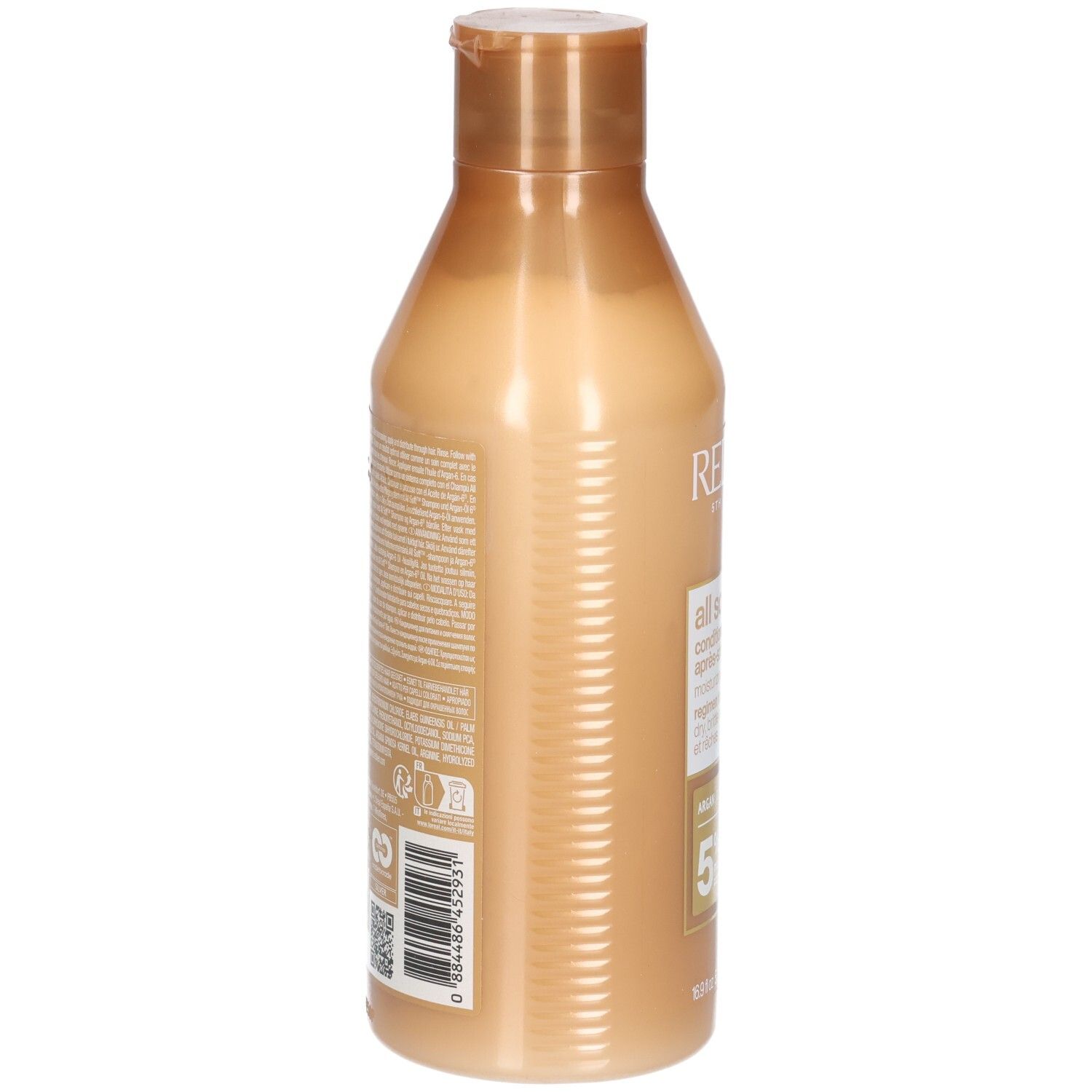 Achterkant van een gouden conditionerfles. Tekst en barcode op het etiket.