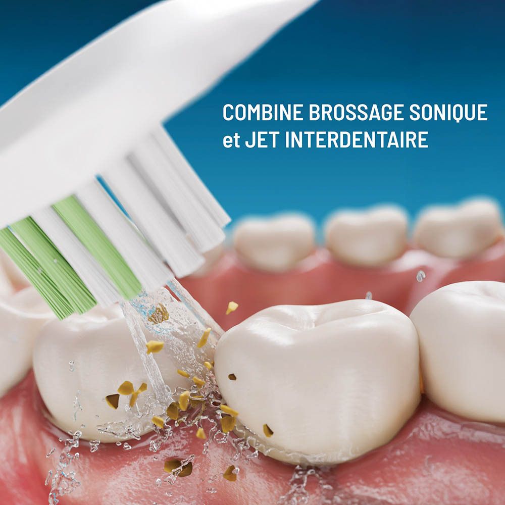 Tête de brosse à dents nettoyant les dents. Jet d'eau et brins éliminent les débris.
