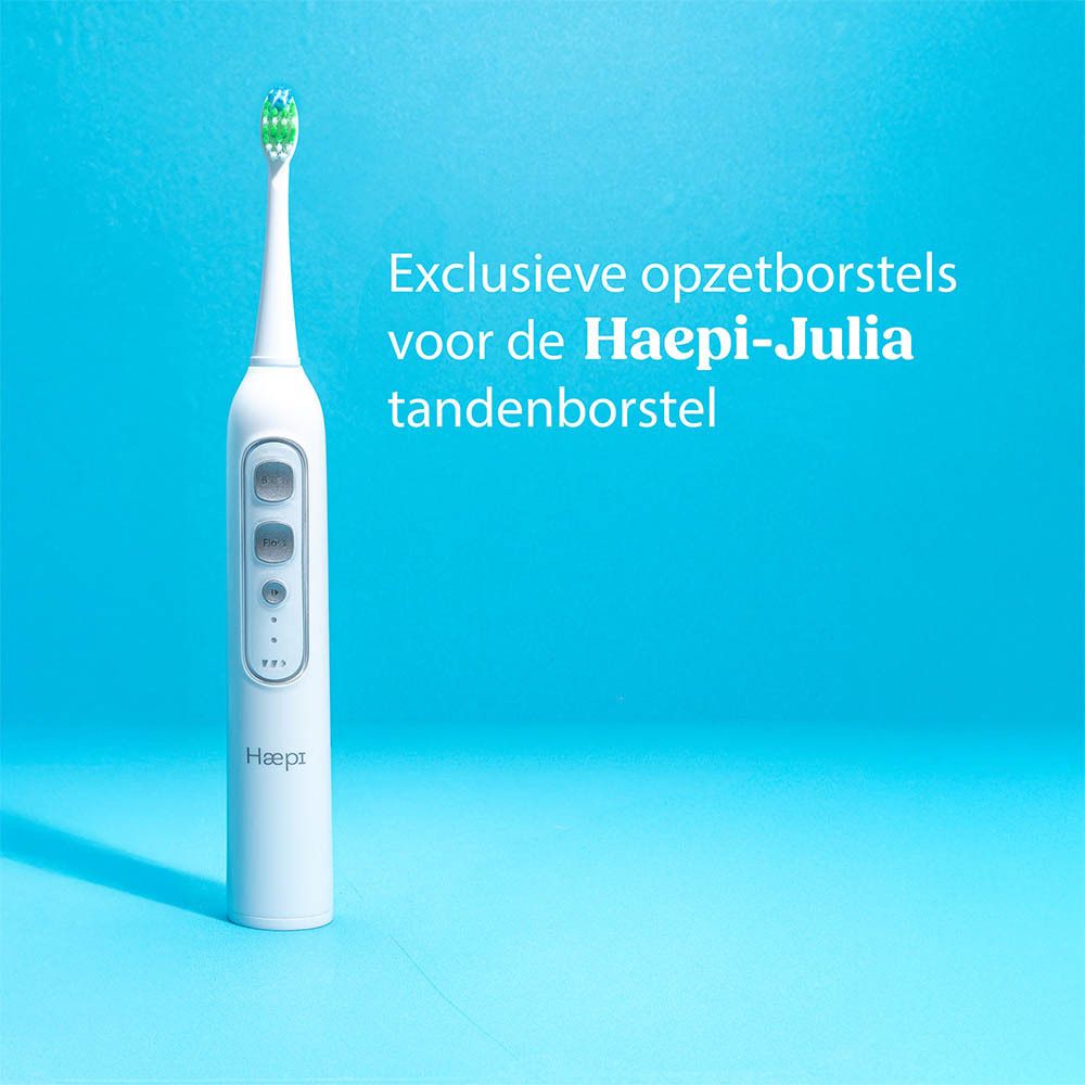 Elektrische tandenborstel Haepi-Julia. Witte behuizing met knoppen. Blauwe achtergrond.