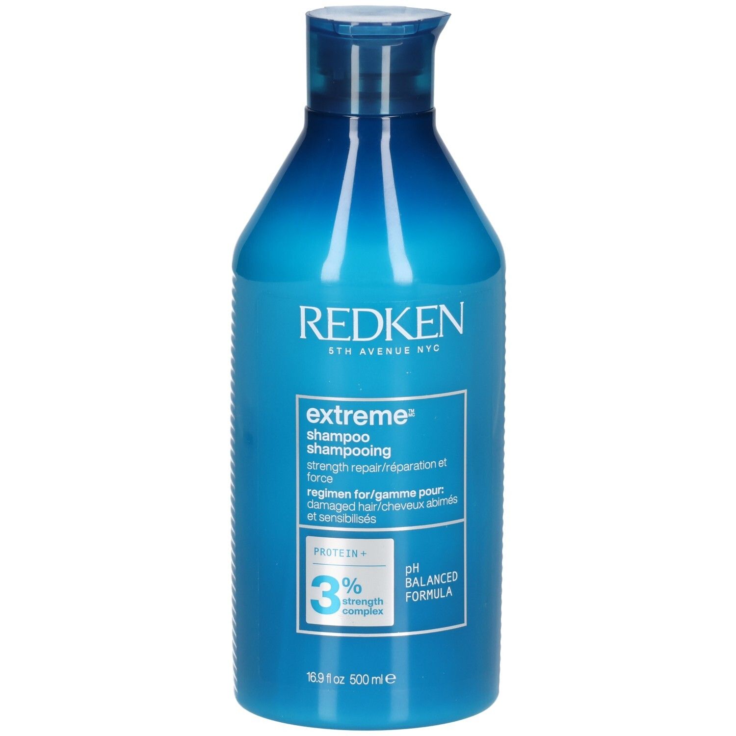 Blauwe shampoo fles. Opschrift: Redken, extreme shampoo, 3% strength complex, pH balanced formula. 500ml.