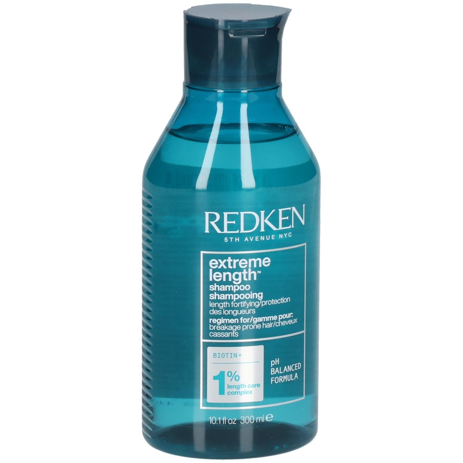 Blauwe, transparante shampoo fles. Opschrift: Redken, Extreme Length Shampoo. Bevat biotine. pH-gebalanceerde formule.