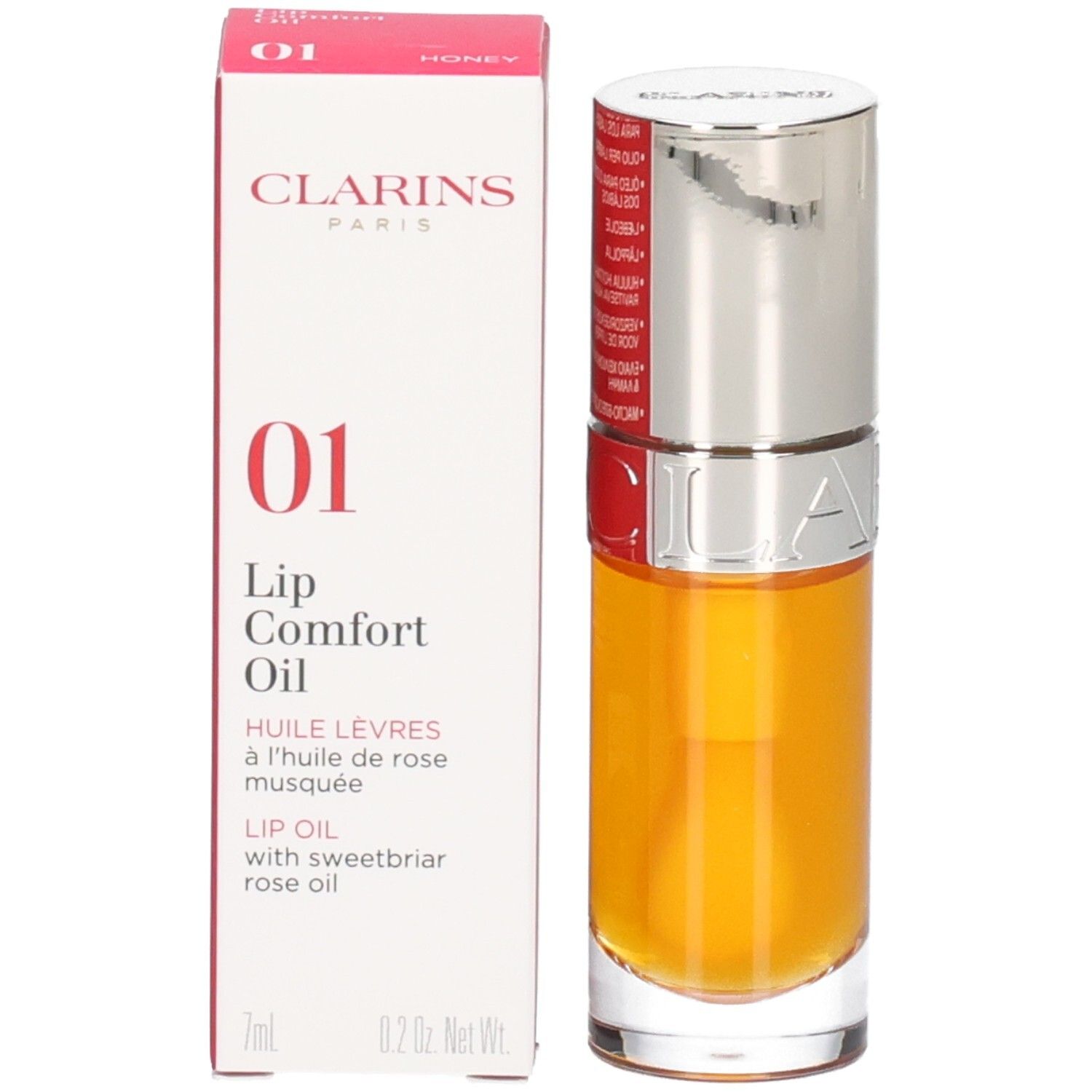 Clarins Lip Comfort Oil 01 - Honey en de verpakking. Het flesje heeft een zilveren dop.