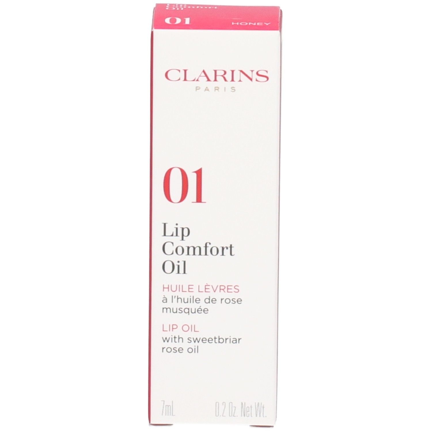 Clarins Lip Comfort Oil 01 - Honey en de verpakking. Het flesje heeft een zilveren dop.
