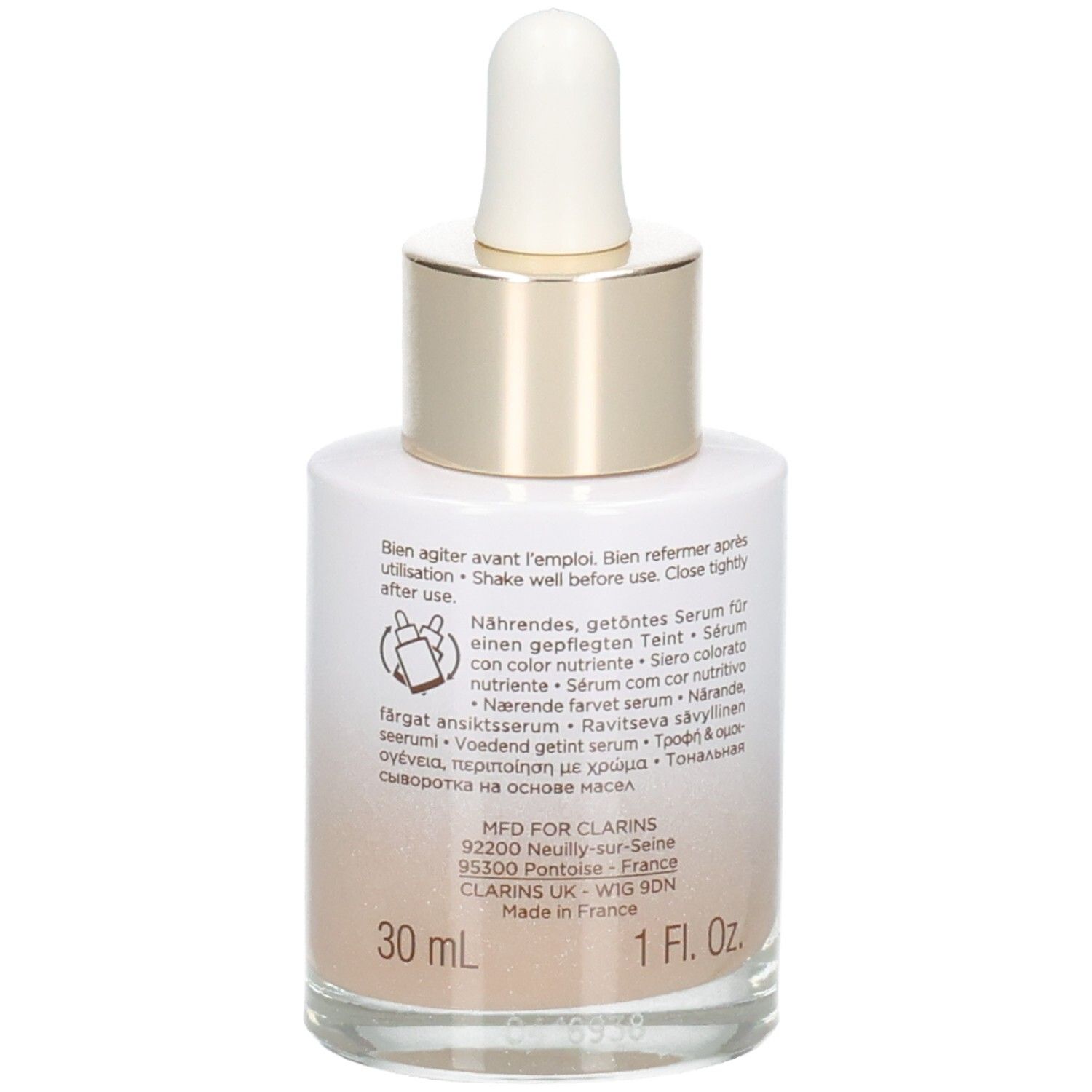 Clarins Tinted Oleo-Serum 04 : flacon en verre avec pipette, 30 ml. Arrière avec instructions et détails de fabrication.