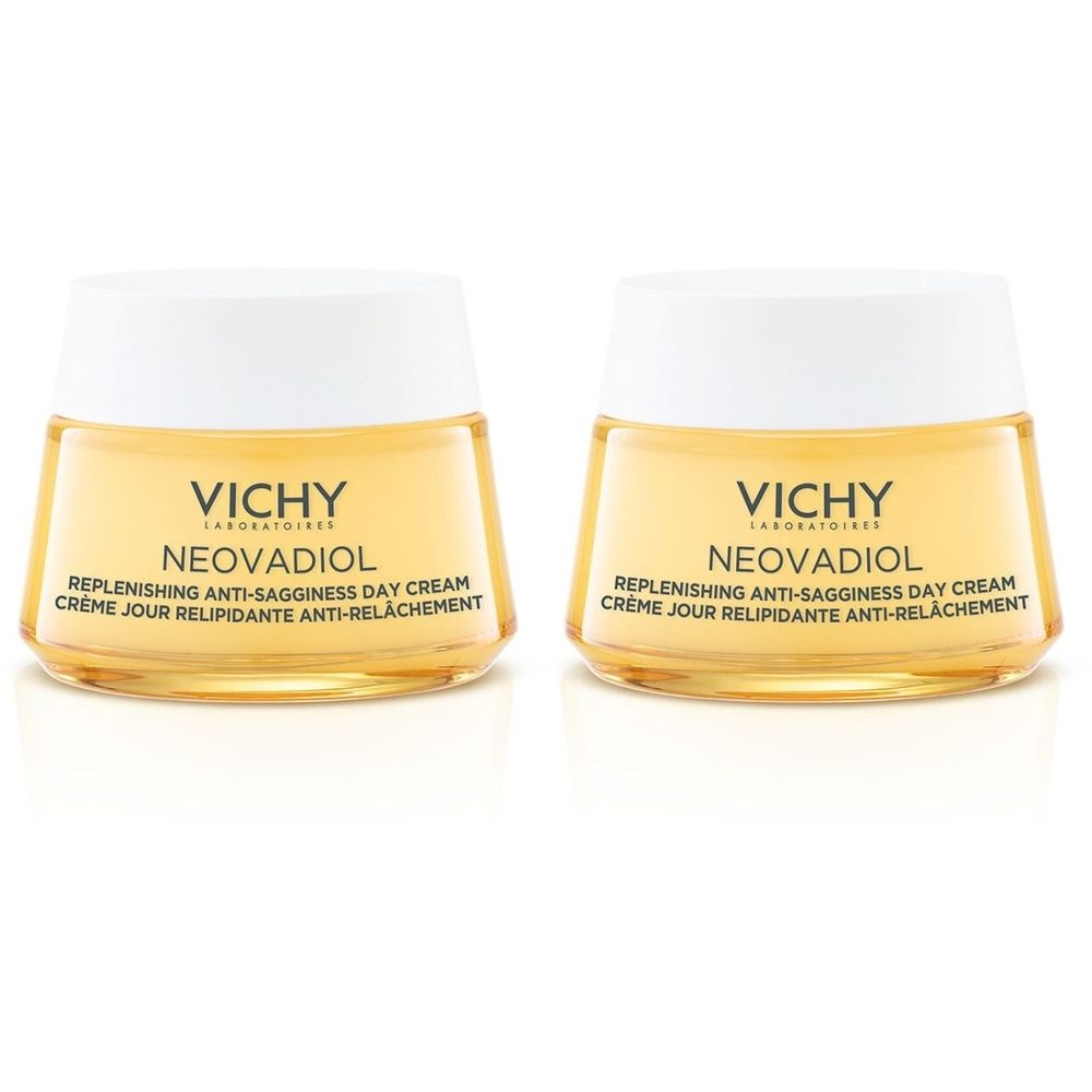 Deux pots de crème avec couvercles blancs et contenu jaune. Inscription: VICHY, NEOVADIOL, Replenishing Anti-Sagginess Day Cream, Crème Jour Relipidante Anti-Relâchement.