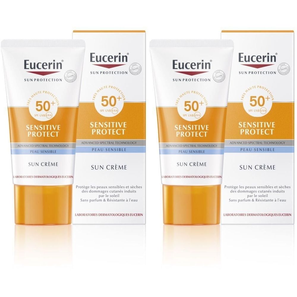 Twee tubes en twee dozen Eucerin Sun Creme SPF 50+. Witte tubes met oranje en blauwe accenten. Opschrift: Sensitive Protect.