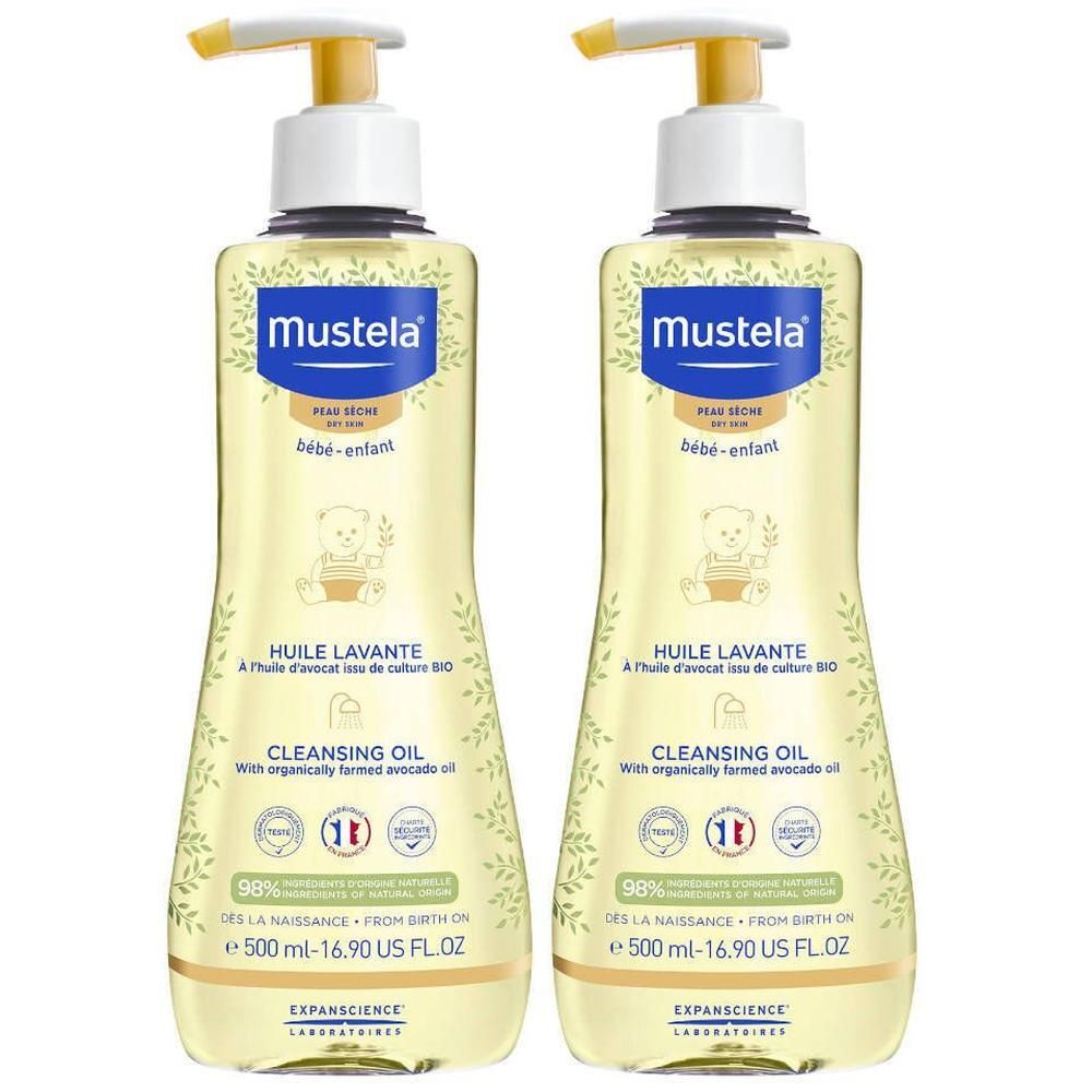 Twee flessen Mustela reinigingsolie met gele pomp. Opschrift: HUILE LAVANTE, CLEANSING OIL. Bevat 98% ingrediënten van natuurlijke oorsprong.