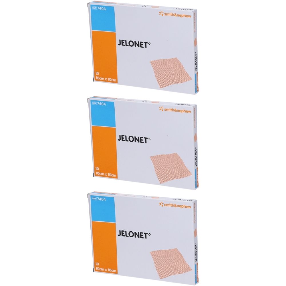Drie dozen Jelonet 10cm x 10cm. Witte verpakking met blauw-oranje accent. Opschrift: Jelonet, 10 x 10cm.