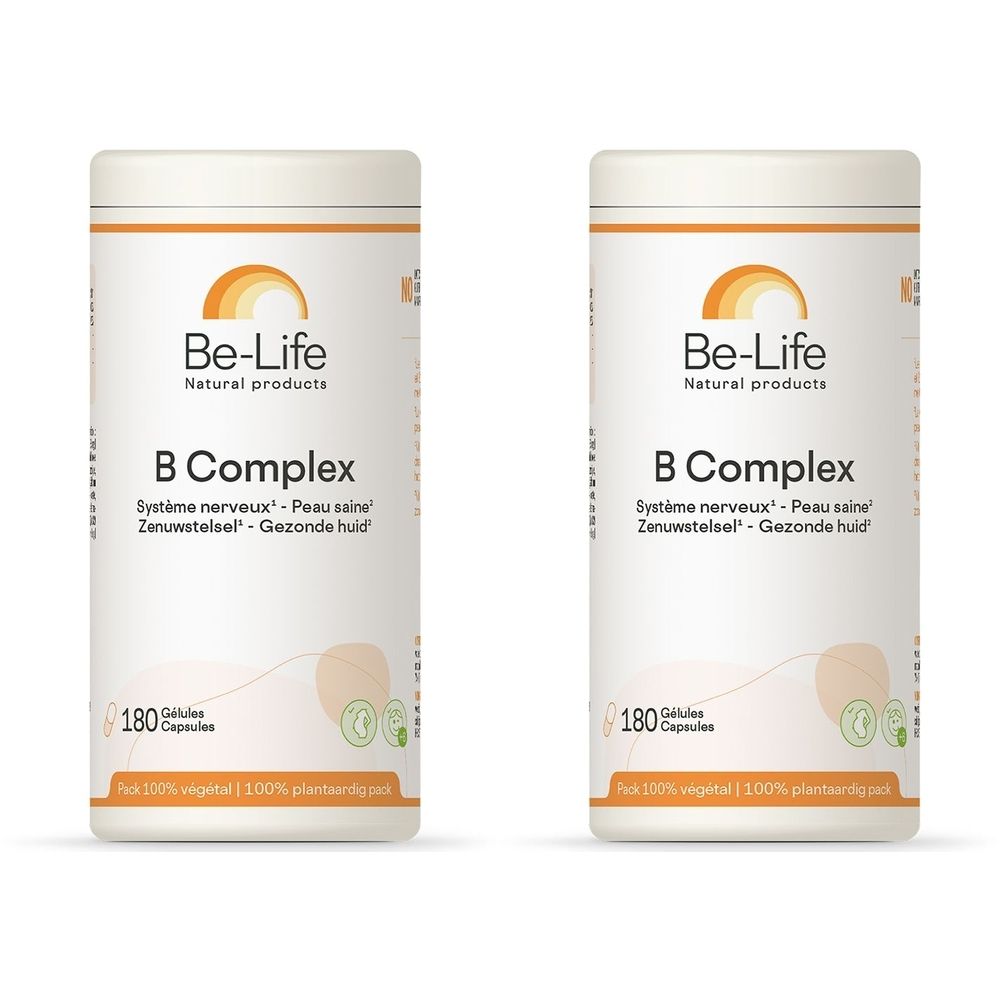 Twee witte potten met "Be-Life B Complex". Bevat 180 capsules. Tekst: Système nerveux - Peau saine, Zenuwstelsel - Gezonde huid.