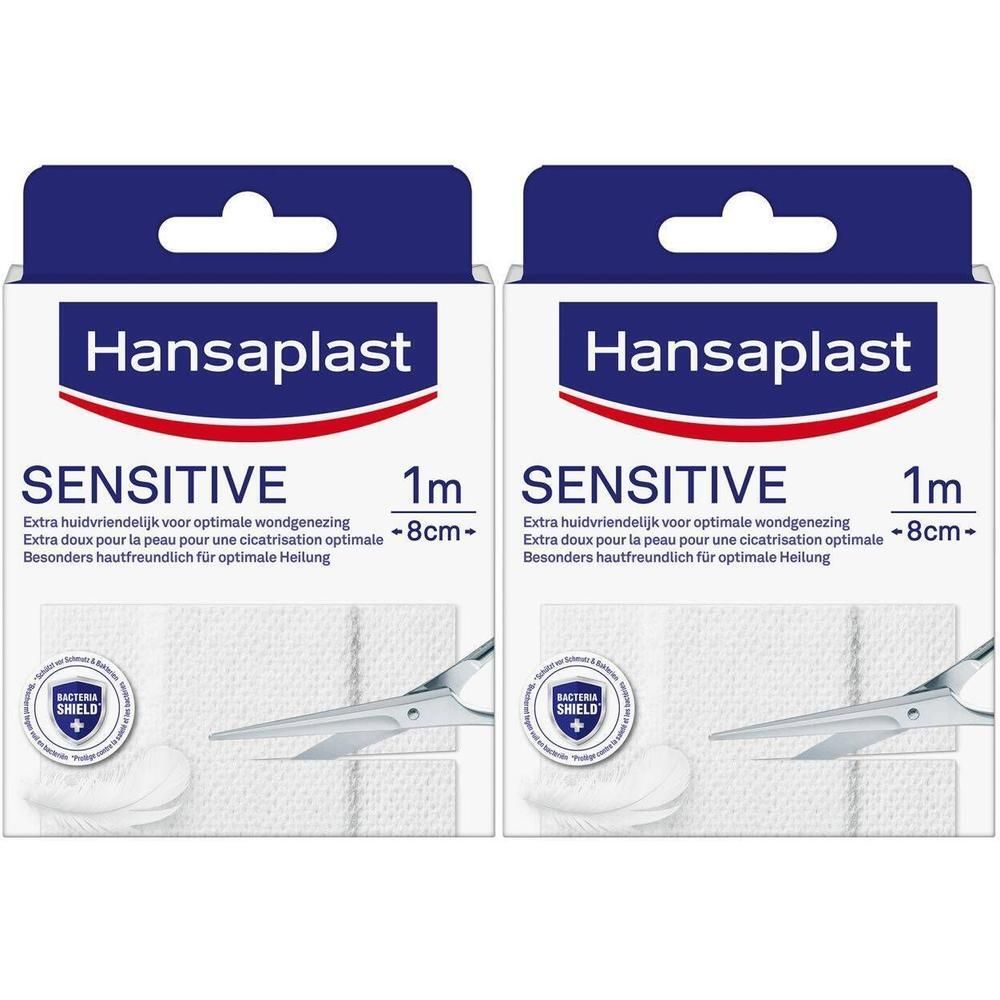 Twee verpakkingen Hansaplast Sensitive Pansement. Witte pleisters, schaar, blauwe verpakking met logo en tekst. 1 m x 8 cm.