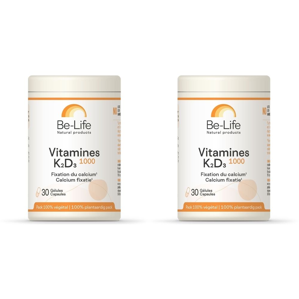 Twee witte potten met opschrift "Be-Life Vitamines K2D3 1000". Opschrift "Fixation du calcium". 30 capsules.