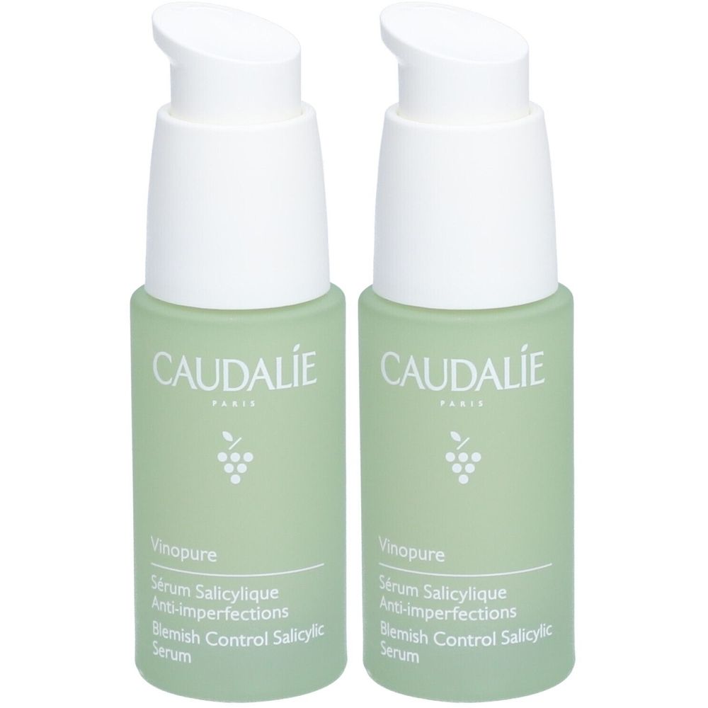 Deux flacons verts avec des pompes blanches. Chaque flacon porte les inscriptions "CAUDALIE" et "Vinopure Sérum Salicylique Anti-Imperfections".