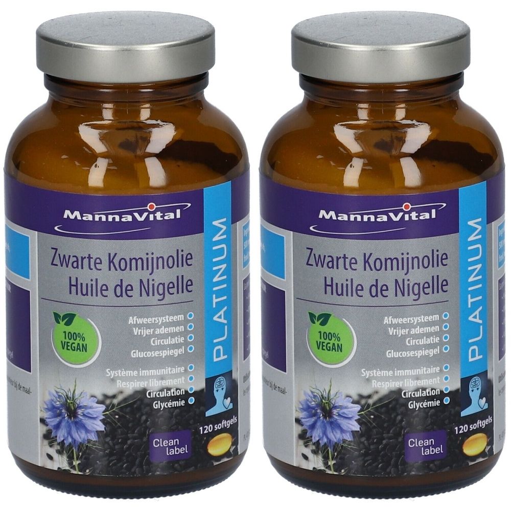 Twee bruine glazen flessen met zilveren doppen. De etiketten tonen "MannaVital Zwarte Komijnolie Huile de Nigelle Platinum".
