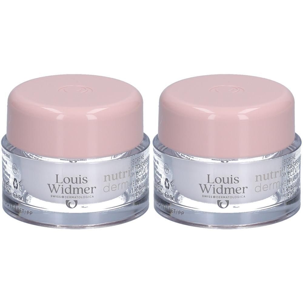 Twee potjes Louis Widmer Nutriderm Crème de Jour Éclat Rosé UV50. Roze deksels, zilverkleurige potjes, productnamen.